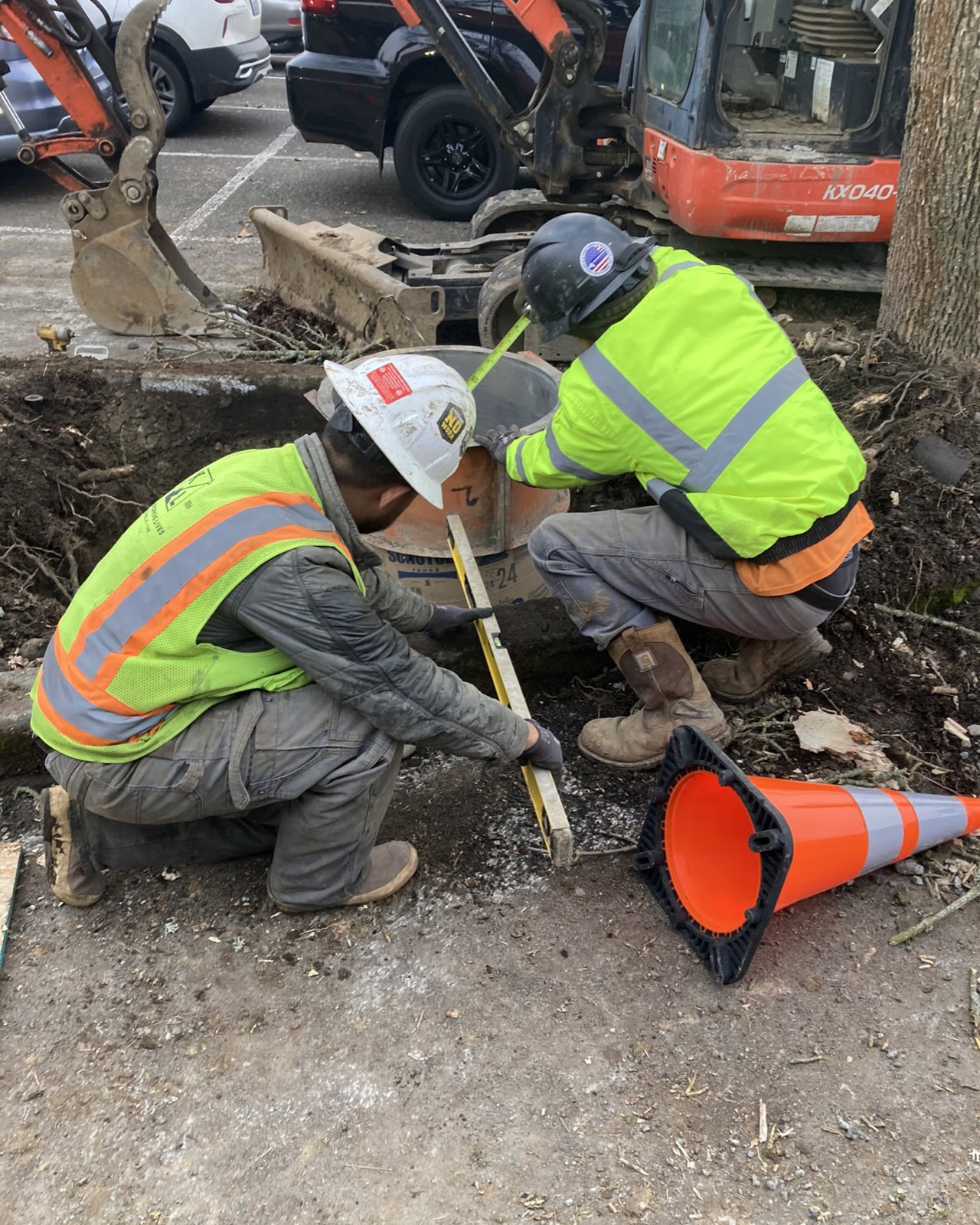Crew building a light pole base