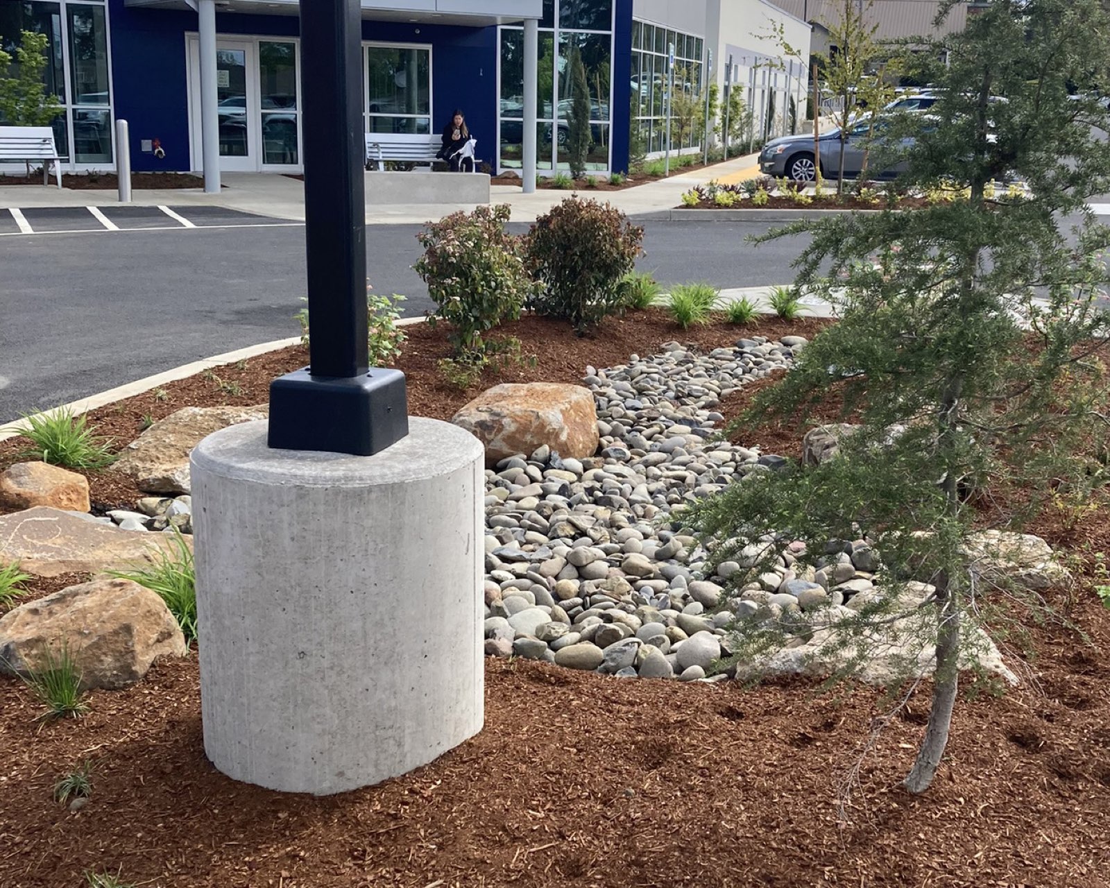 Crew setting a light pole base